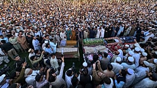 Mourners attend funeral prayers of children who were killed in a roof collapse of a private school in Peshawar, 15 October, 2026
