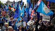 Members of a pro-EU band perform as they protest outside the Houses of Parliament in London, Tuesday, Sept. 3, 2019.