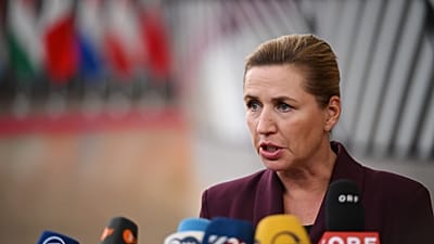 Denmark's Prime Minister Mette Frederiksen speaks with the media as she arrives for the EU summit in Brussels