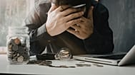 A man stresses over money