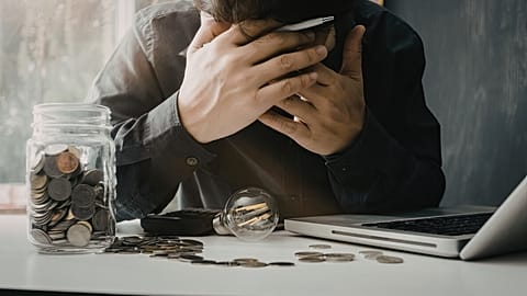 A man stresses over money