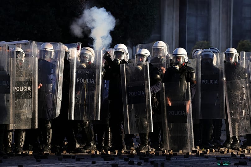 Riot police fire tear gas at protesters during an anti-government demonstration in Tirana, Albania, Friday, 16 Oct., 2026.