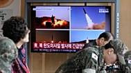 A TV screen shows file images of North Korean missiles launch during a news program at Seoul Railway Station in Seoul, South Korea, Monday, Oct. 12, 2026.