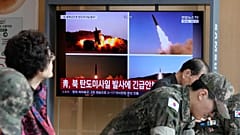 A TV screen shows file images of North Korean missiles launch during a news program at Seoul Railway Station in Seoul, South Korea, Monday, Oct. 12, 2026.