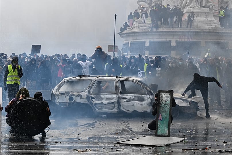 Protesters confront police during a demonstration against rising living costs and in support of students’ grievances in Paris, Saturday, Oct. 17, 2026.