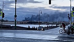 Smoke billows from the area of an oil terminal in St Petersburg after drone attack