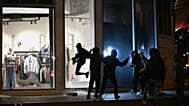 Youths break a store window during clashes between protestors and police in Paris, 18 October, 2026