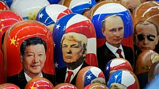 Traditional Russian wooden dolls depicting China's President Xi Jinping, US President Donald Trump and Russian President Vladimir Putin in St. Petersburg, 21 November, 2024