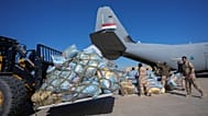FILE: Iraqi security forces prepare humanitarian aid for emergency relief to the earthquake-affected people of Syria, at a military airbase near Baghdad, 18 February 2023
