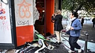 Shopkeepers in Paris surveyed the damage after a night of rioting.