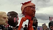 Marchers hold a banner and a papier-mâché figure of US President Donald Trump during a ‘No Kings’ protest in Washington DC, Saturday, Oct. 17, 2026.