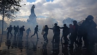 Police scuffle with protesters during a demonstration against rising living costs, joining students' grievances, in Paris, Saturday, Oct. 17, 2026.