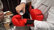A knockout cooking competition with chefs in boxing gloves