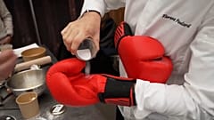 A knockout cooking competition with chefs in boxing gloves