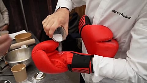 A knockout cooking competition with chefs in boxing gloves