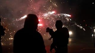Protesters throw fireworks and flares at riot police during an anti-government protest in Tirana, 19 October, 2026