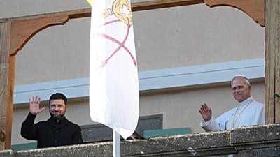 Ukrainian President Volodymyr Zelenskyy, left, and Pope Leo XIV wave to journalists during their meeting in Castel Gandolfo, Italy, on Tuesday 9 December 2025