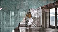 The smashed window of a looted bank after violence erupted in Marseille, 19 October, 2026