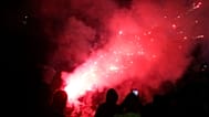 Protesters throw fireworks and flares at riot police during an anti-government protest in Tirana, 19 October, 2026