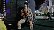 FILE: A security personnel affiliated with the IRGC sits while protecting a pro-government gathering at a square in Tehran, 8 October 2026