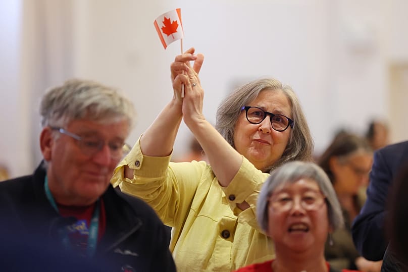 Supporters react to voting results at the pro Canada watch party in Edmonton, Alberta Monday, Oct. 19, 2026. (James Maclennan/The Canadian Press via AP)