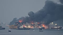  Photo search Search media content Indonesia Ferry Fire Tugboats spray water to extinguish fire burning through the passenger ferry KMP Batumandi, near Merak, Banten province,