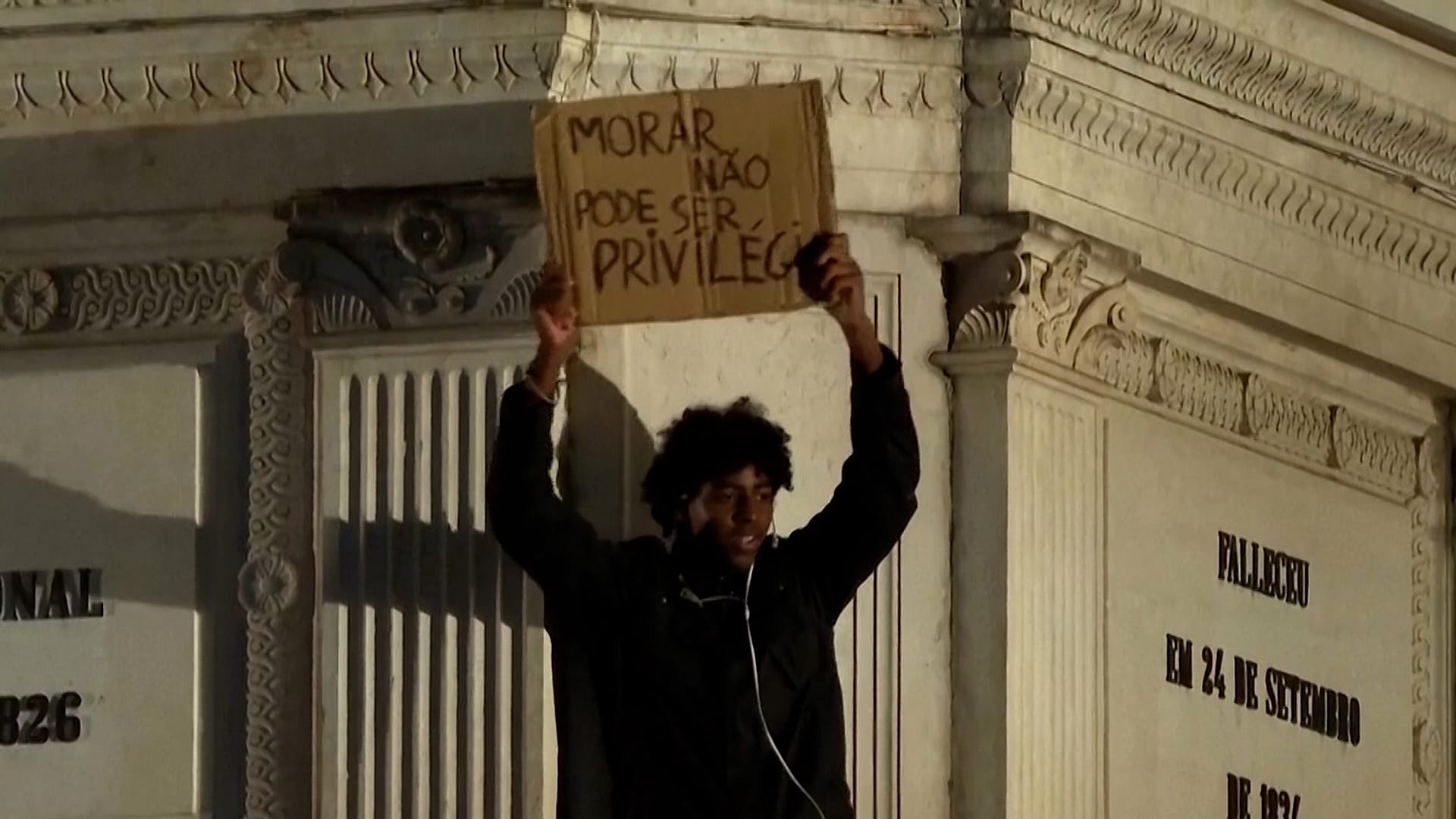 A man holds a sign reading ‘Housing must not be a privilege’ in Lisbon, Portugal, Tuesday, Oct. 20, 2026
