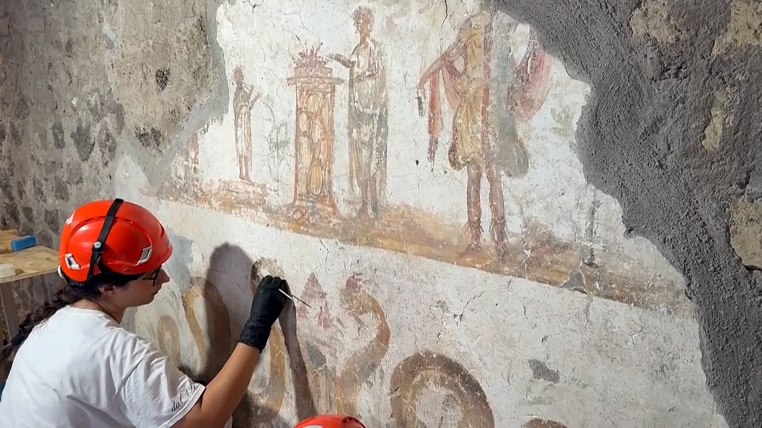 Restorers work to preserve frescoes in Pompeii’s ancient Roman houses