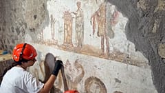 Restorers work to preserve frescoes in Pompeii’s ancient Roman houses
