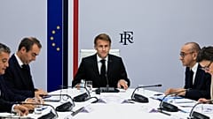 France's President Emmanuel Macron, center, hosts an Interministerial Crisis Meeting at the Elysee Presidential Palace, in Paris, on Sunday, 18 October 2026.
