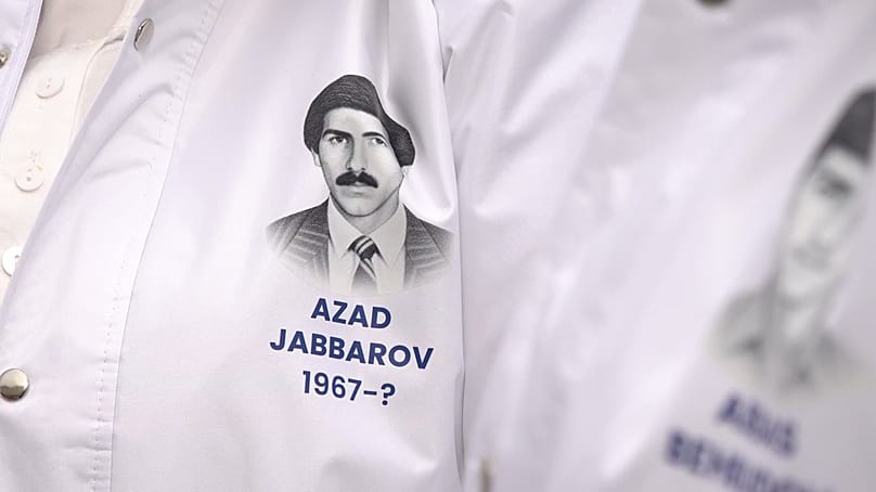Farida Jabbarova wears a jacket honoring her husband who has been missing for 34 years. 