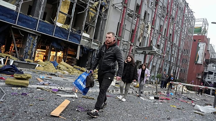 Russian drone attack kills two in Kyiv as residents survey damage
