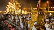 Devotees carry a Taoist sedan chair over burning charcoal during celebrations of the Nine Emperor Gods Festival in Kuala Pilah, Malaysia on Saturday, Oct. 17, 2026.