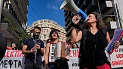 Protesters take part in a rally organized by teachers and students demanding improvements to education and measures to address the rising cost of living in Athens