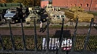 A man walks past Ukrainian military vehicles captured during the fighting in Ukraine on display in St. Petersburg, Russia. 21 October 2026