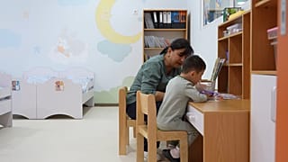 A child at the Imkon Center in Samarkand