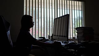 FILE — Alice Lin was the victim of an online scammer, pictured here sitting at her computer at home, Saturday, May 9, 2026, in Alhambra, Calif. 