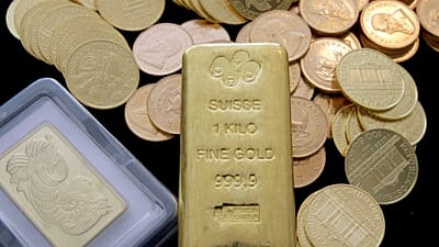 FILE. Gold coins and gold bars are shown at the California Numismatic Investments, Inc. in Inglewood California, 13 March 2008
