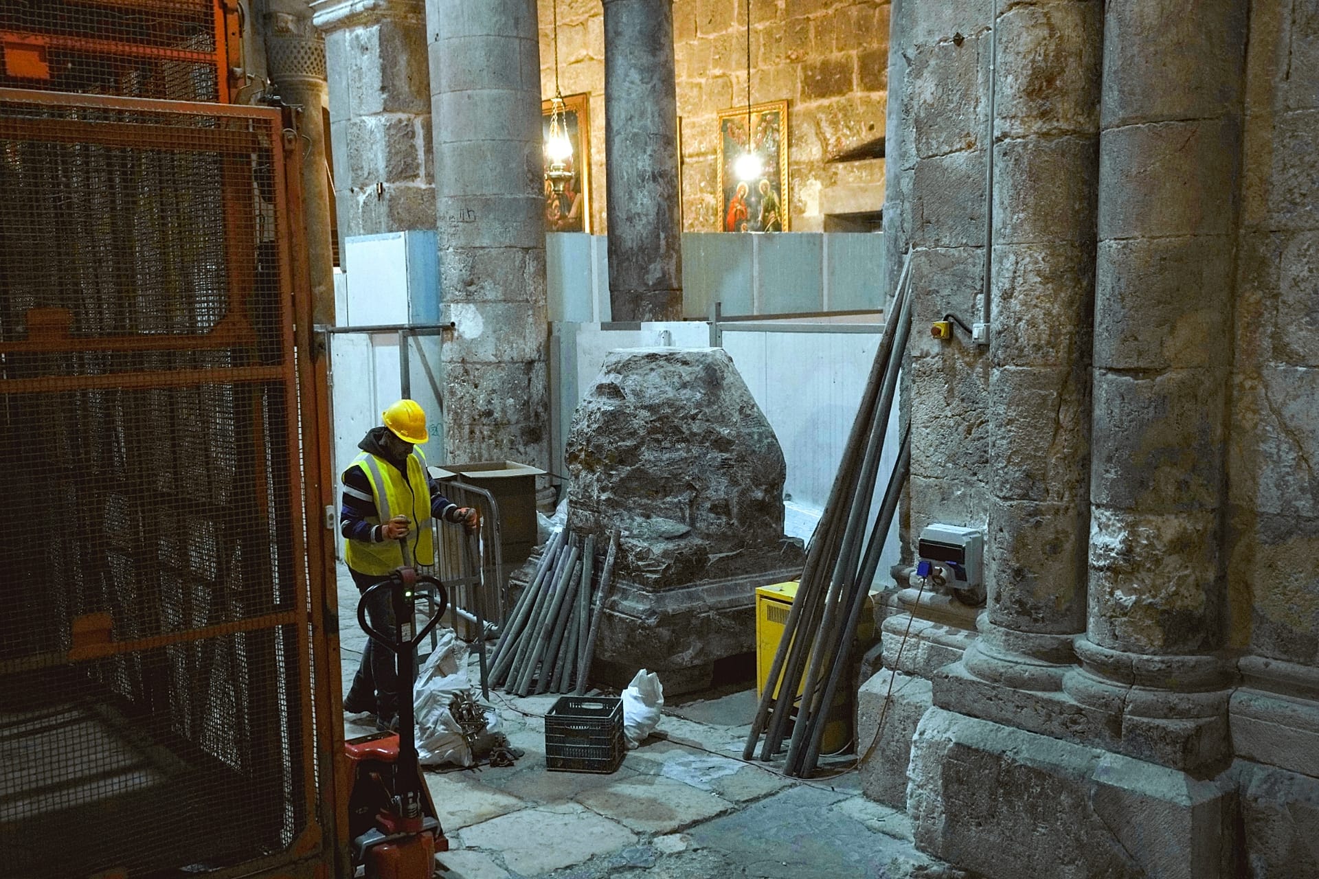 A member of the restoration team works on the floor of the Church of the Holy Sepulchre, where many Christians believe that Jesus was crucified, buried and rose
