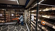 A woman looks at empty shelves in a supermarket following truckers protesting against high fuel prices, in Naples, Italy, Thursday Oct. 22, 2026.