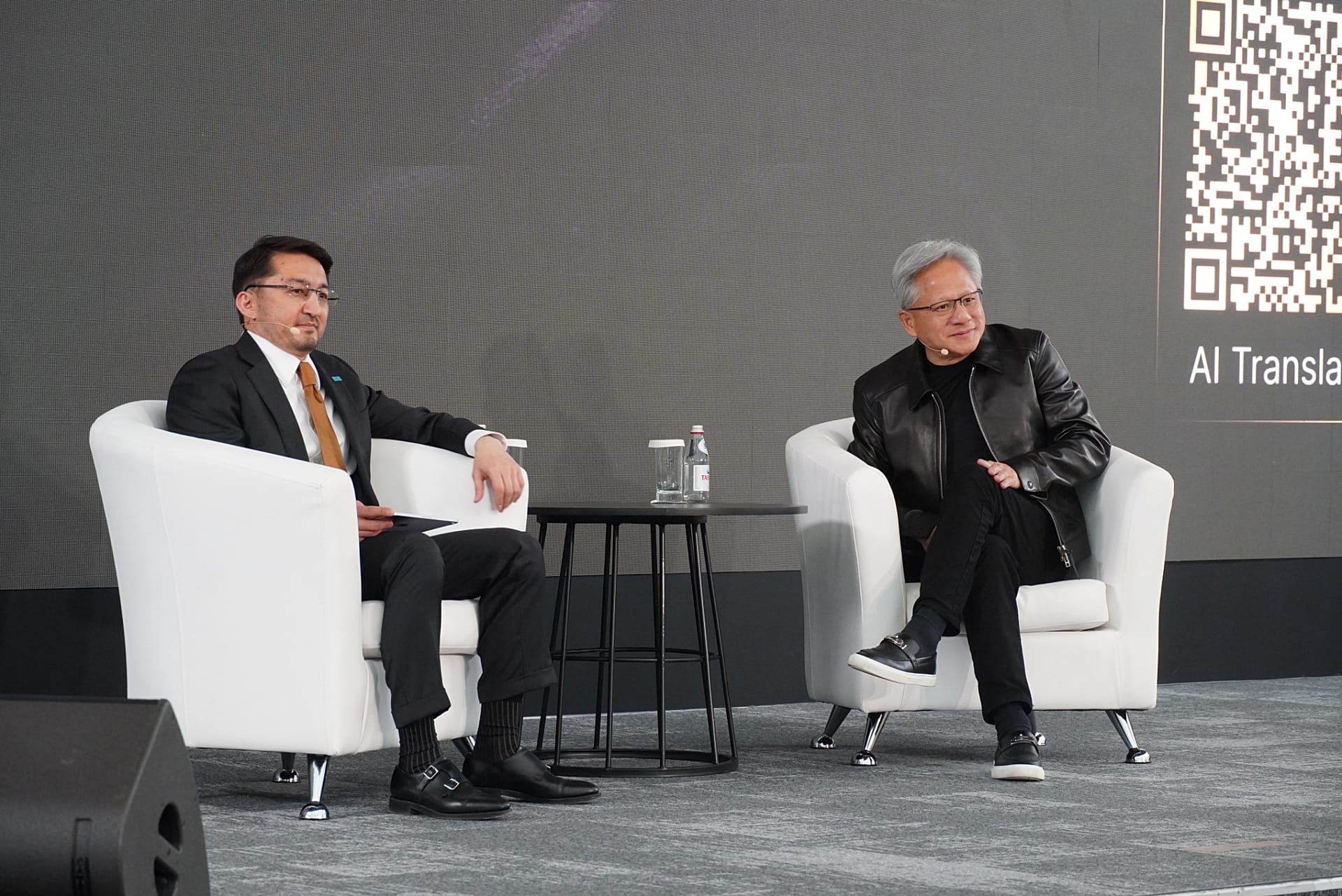 Kazakhstan's Deputy Prime Minister Zhaslan Madiyev and Nvidia CEO Jensen Huang during a fireside chat at Alem.ai in Astana.
