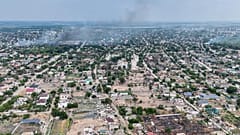 FILE: smoke rises from a residential neighborhood in the Russian-occupied city of Oleshky in the Kherson region of Ukraine. Sept. 22, 2026,