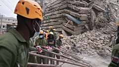 Security forces and civil defense work after a multi-story building collapsed in Nairobi