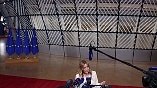 Italy's Prime Minister Giorgia Meloni speaks with the media at the end of the EU summit in Brussels, Friday, Oct. 16, 2026. 
