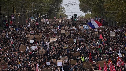 Protesters march during a demonstration against rising living costs in Paris, Saturday, Oct. 24, 2026.