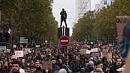 Protesters march during a demonstration against rising living costs in Paris, Saturday, Oct. 24, 2026.