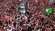 Brazilian President Luiz Inacio Lula da Silva, center, waves to supporters during his final campaign rally on Copacabana beach ahead of Brazil's presidential runoff election