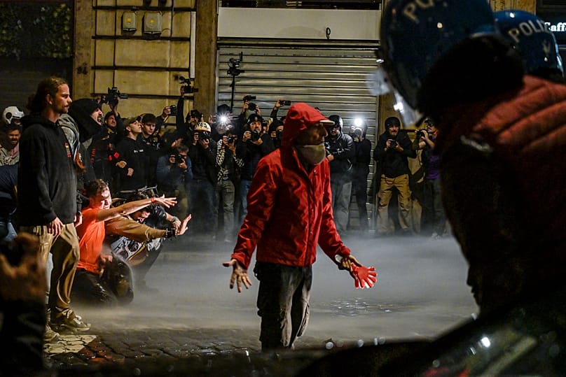 People attend a protest in Rome, Italy, Saturday, Oct. 24, 2026. (Valentina Stefanelli/LaPresse via AP)