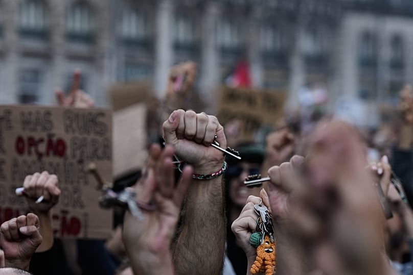 People hold keys during a protest to demand affordable housing in Lisbon, Saturday, Oct. 24, 2026. (AP Photo/Ana Brigida)