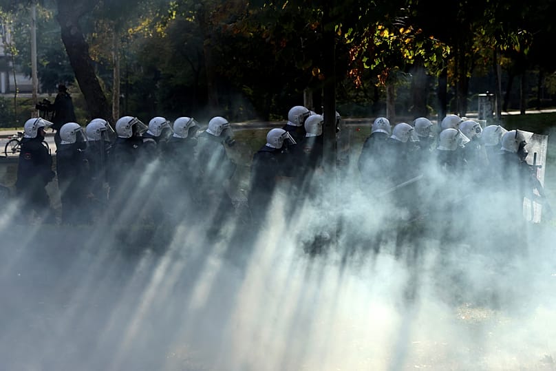 Riot police advance during an anti-government rally in Tirana, Albania, Saturday, Oct. 24, 2026. (AP Photo/Hameraldi Agolli)